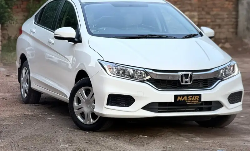A Nasir Car Home car with its driver, ready for the day