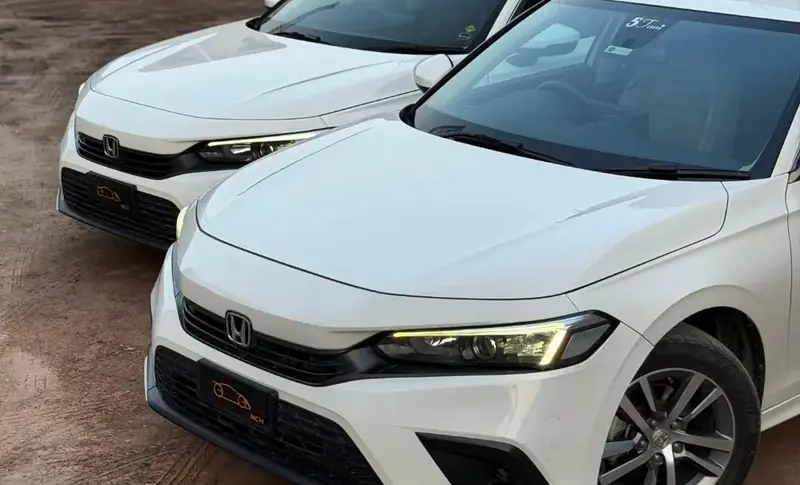 Two of Nasir Car Home's cars, ready for airport runs